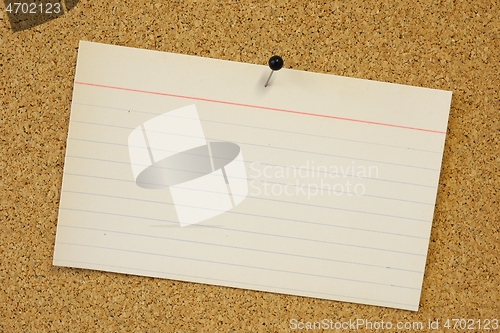 Image of sticky note card pinned to cork background