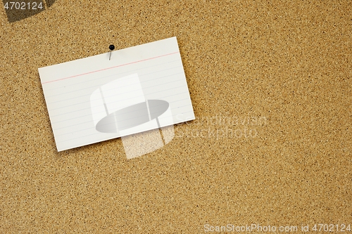 Image of sticky note card pinned to cork background