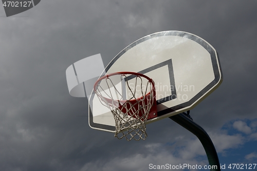 Image of basketball hoop on sky background outdoor