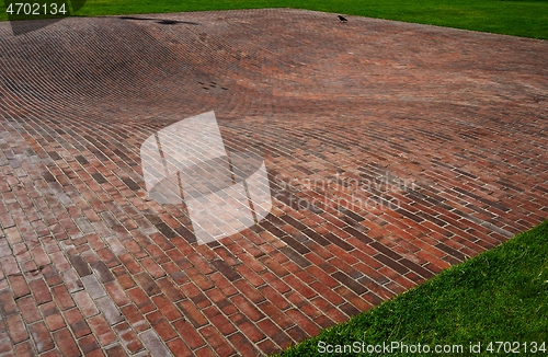 Image of concave red brick platform