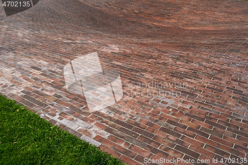 Image of concave red brick platform