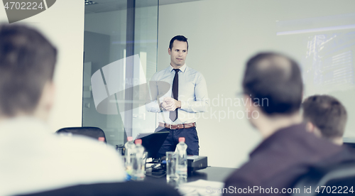 Image of Team leader making presentation on corporate business meeting.