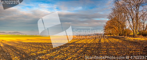 Image of Autumn plowed field at amazing sunrise. Czech Republic