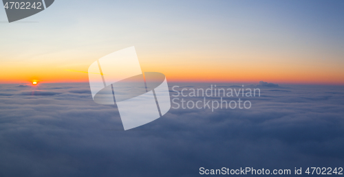 Image of Amazing sunrise above clouds from the top of the mountain 