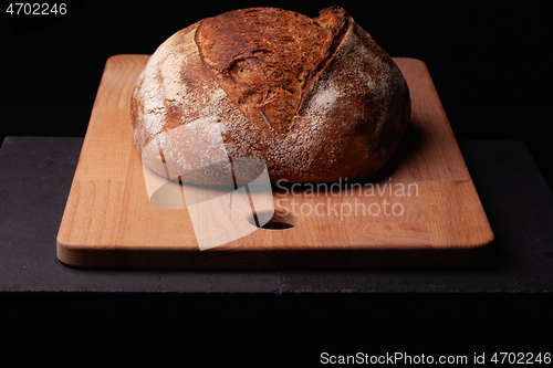 Image of Artisan sourdough bread. on the black background. 