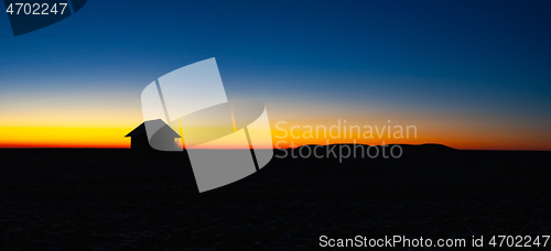 Image of Old barn on the field at sunrise