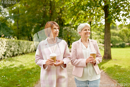 Image of senior women or friends drinking coffee at park