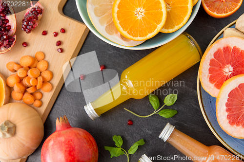 Image of glass bottles of fruit and vegetable juices