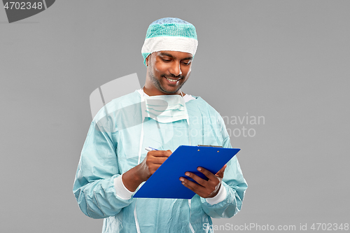 Image of indian male doctor or surgeon with clipboard