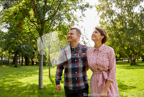 Image of happy couple in summer park