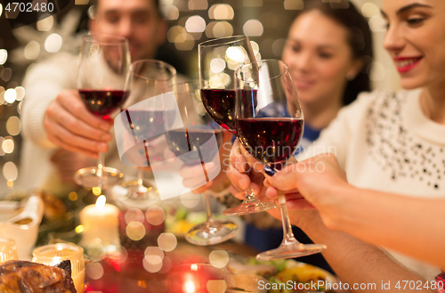 Image of close up of friends with wine celebrate christmas