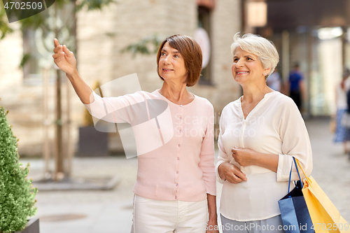 Image of senior women with shopping bags in tallinn city