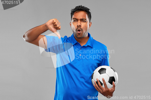 Image of football fan with soccer ball showing thumbs down