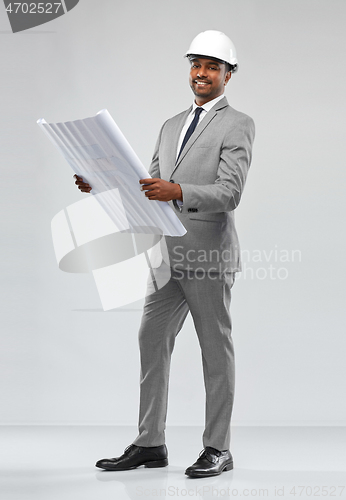 Image of indian male architect in helmet with blueprint