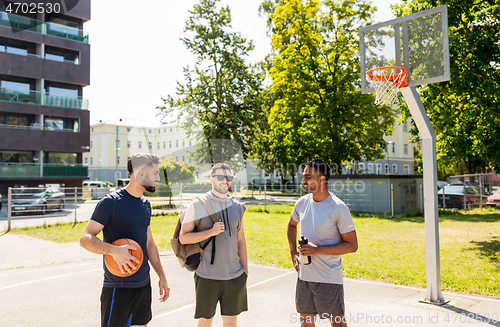 Image of group of male friends going to play basketball