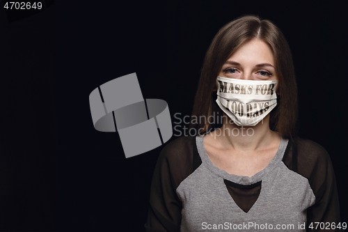 Image of Woman wearing protective face mask with sign masks for 100 days in USA, America