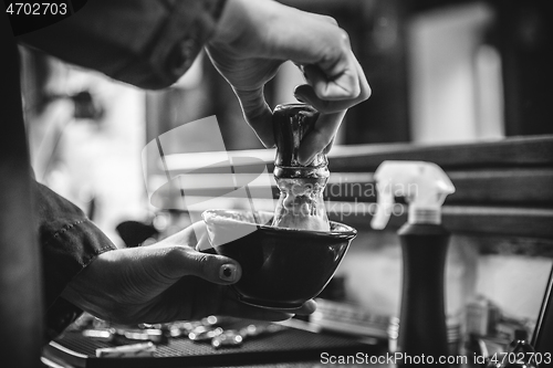 Image of Female barber in barber shop