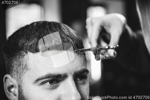 Image of Client during beard shaving in barber shop