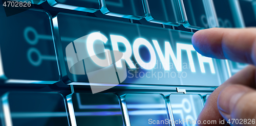 Image of Growth - Man Pushing Button on Futuristic Interface.