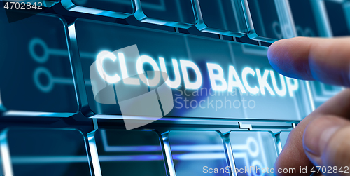 Image of Cloud Backup - Man Pushing Button on Futuristic Interface.