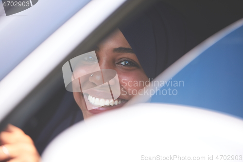 Image of Arabic Woman Traveling By Car