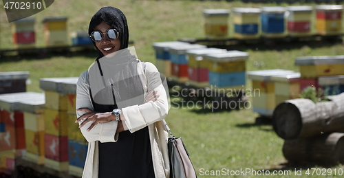 Image of african muslim businesswoman portrait on small local honey production farm