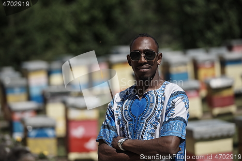 Image of african beekeeper local black honey producer