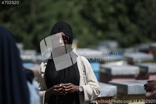 Image of african muslim businesswoman portrait on small local honey production farm