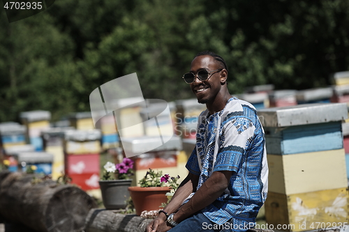 Image of african beekeeper local black honey producer