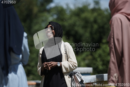 Image of woman giving presentation to group of business investors on local honey production farm