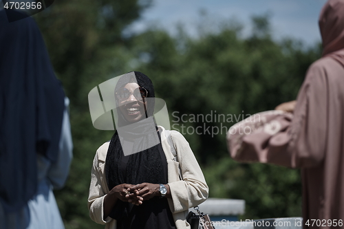 Image of woman giving presentation to group of business investors on local honey production farm