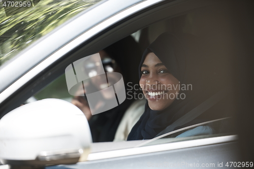 Image of Arabic Woman Couple Traveling By Car