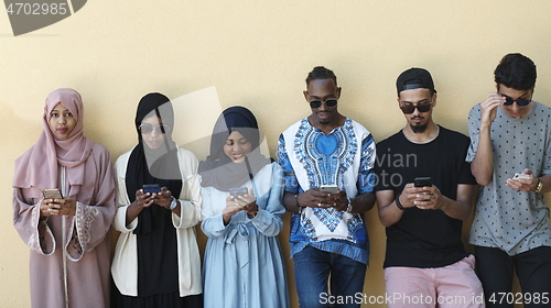 Image of multiethnic startup business people group using smart phones