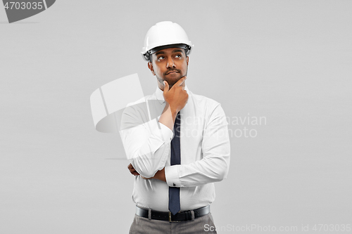 Image of indian male architect in helmet over grey