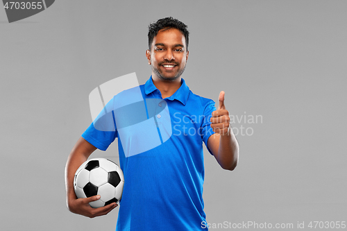 Image of football fan with soccer ball showing thumbs up