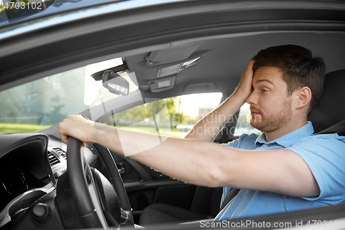 Image of tired sleepy man or driver driving car