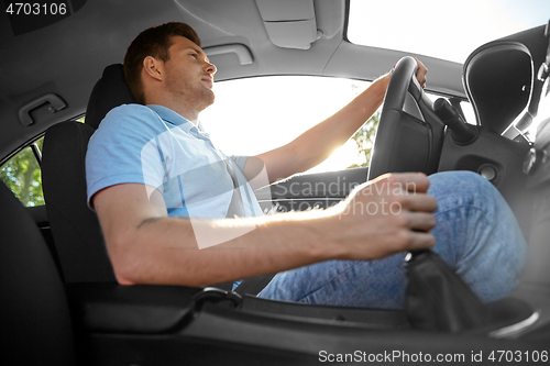 Image of man or driver driving car