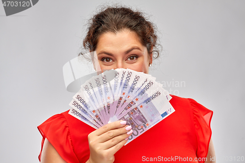 Image of happy woman holding euro money banknotes