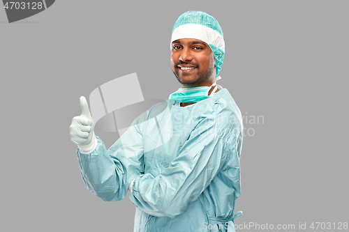 Image of indian male doctor or surgeon showing thumbs up