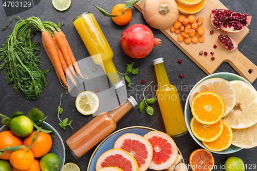 Image of glass bottles of fruit and vegetable juices