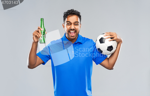 Image of football fan with soccer ball celebrating victory