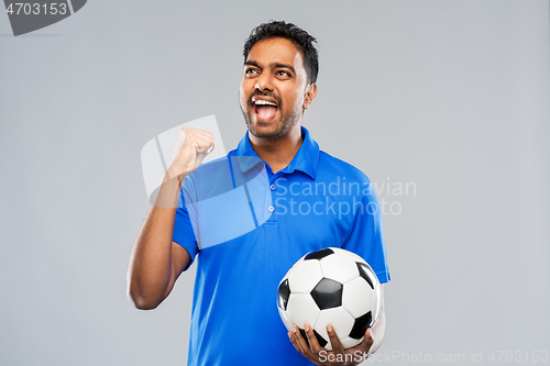 Image of football fan with soccer ball celebrating victory