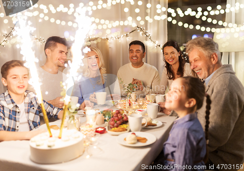 Image of happy family having dinner party at home