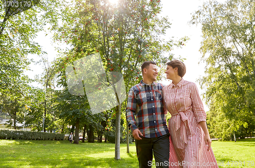 Image of happy couple in summer park