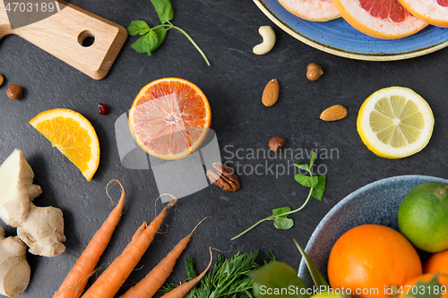 Image of different vegetables and fruits on on slate table