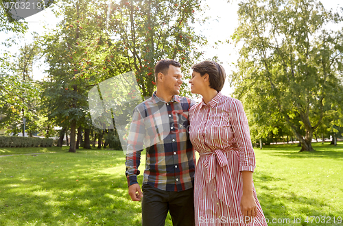 Image of happy couple in summer park