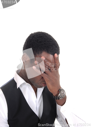 Image of Black man covering his face