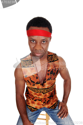 Image of Serious looking African man in a vest