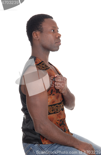 Image of Good looking African man in a brown vest