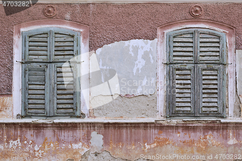 Image of windows with shutters on abandoned traditional house